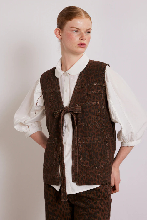 Woman wearing leopard print vest