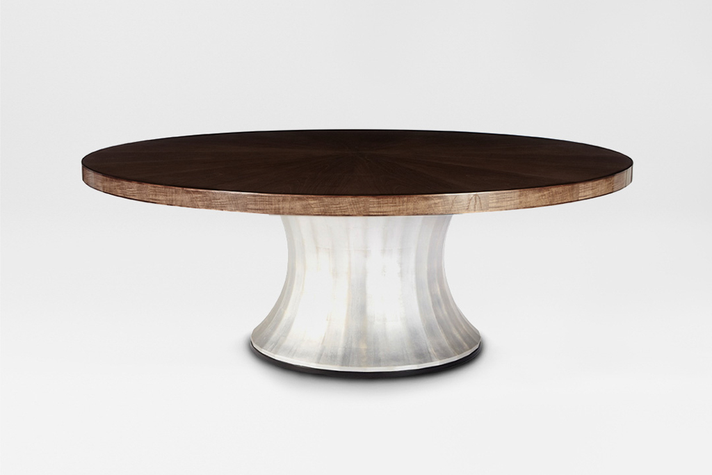 A round dining table with a high gloss sycamore dusk top and a gilded white gold leaf pedestal base. Design by DAVIDSON London.
