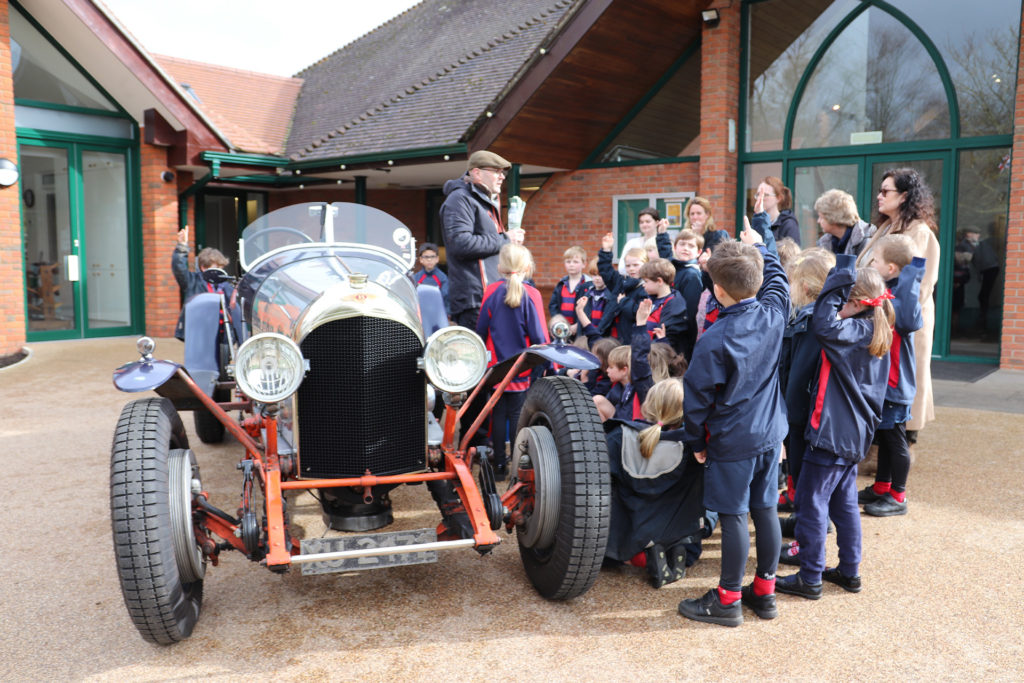 Pre-prep children at Highfield and Brookham get a close look at one of William Medcalf’s vintage cars.