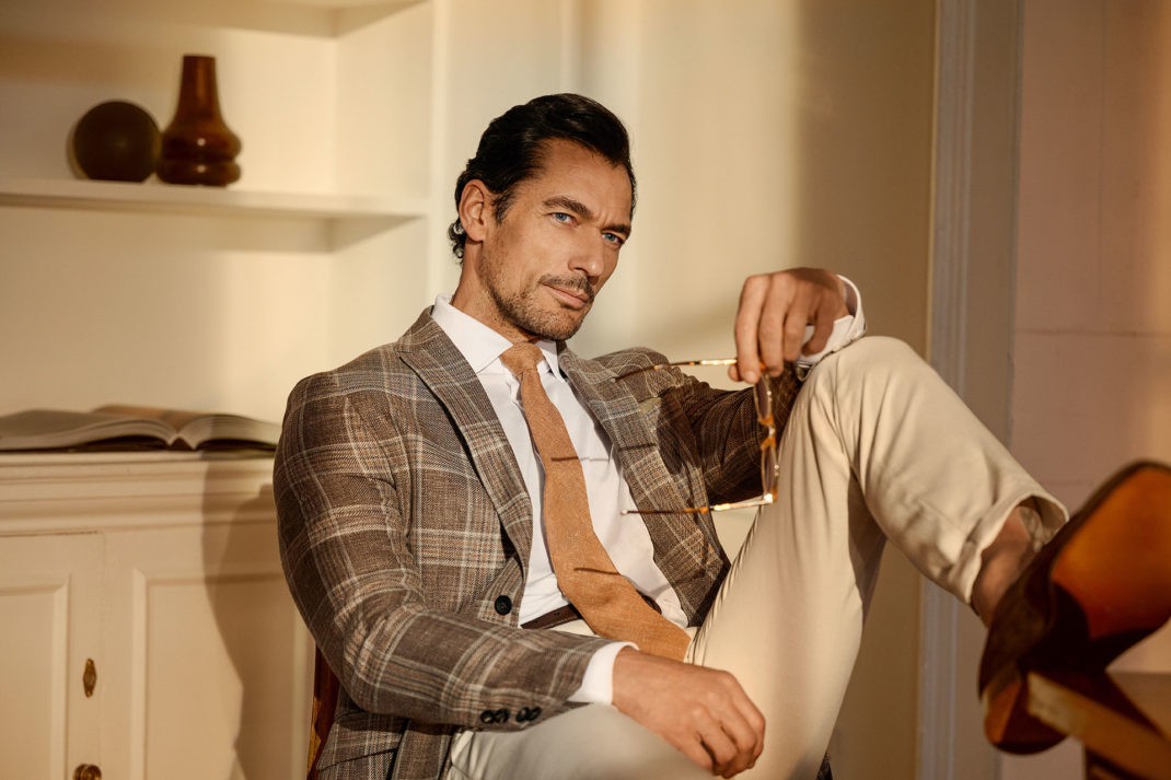 Model David Gandy sitting on chair wearing Hackett SS24 collection British Luxury News april 2024