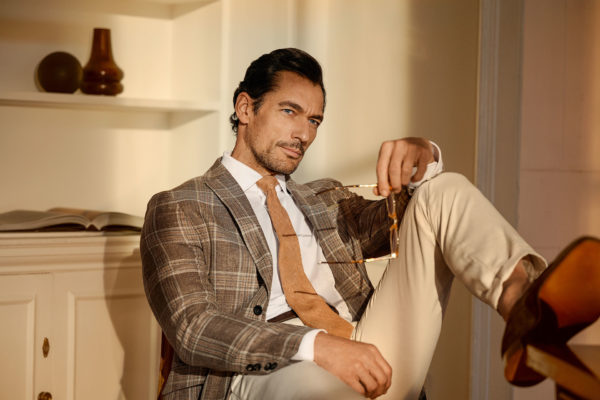 Model David Gandy sitting on chair wearing Hackett SS24 collection British Luxury News april 2024