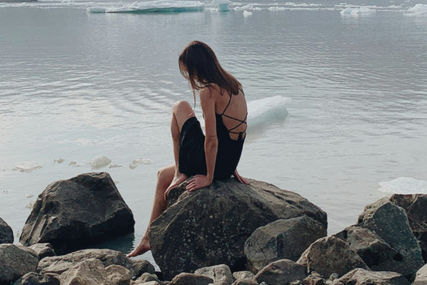 Woman sat on rock