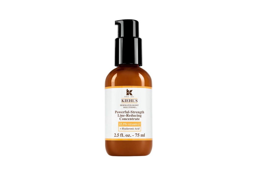 Brown and black serum pump bottle with white label