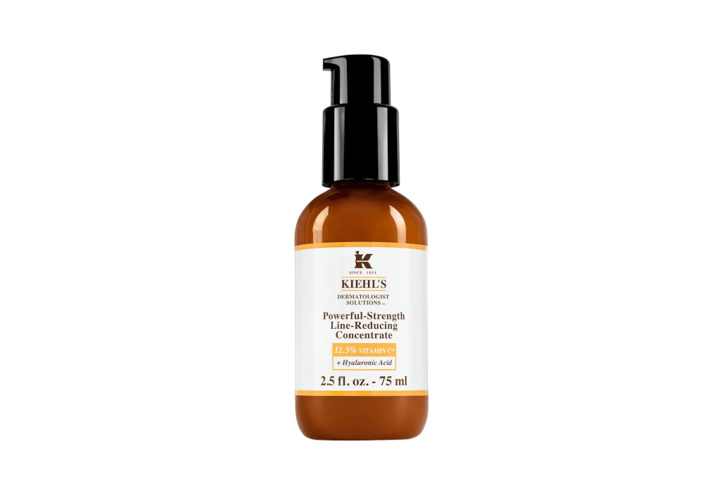 Brown and black serum pump bottle with white label