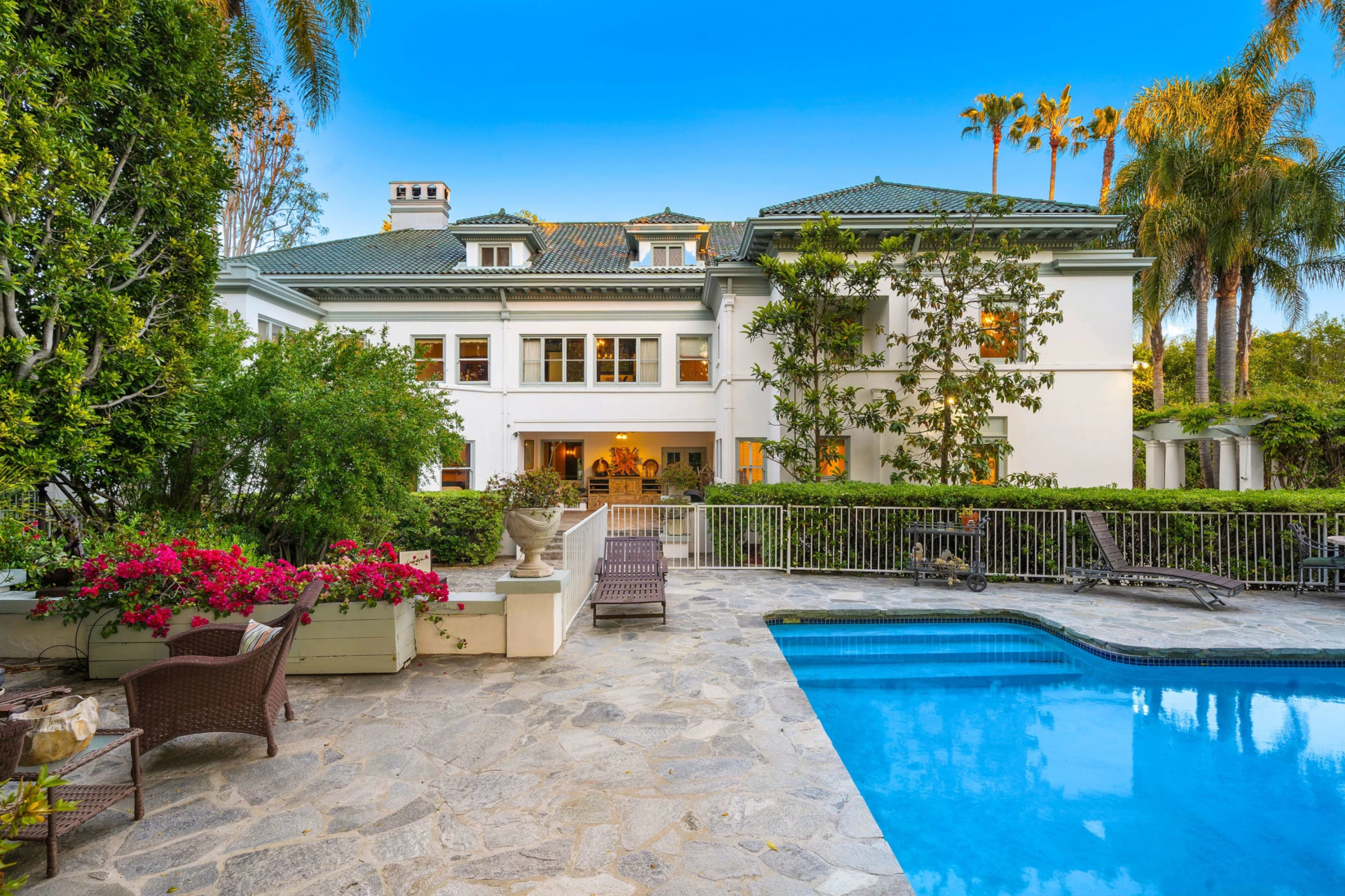 BAck of house with patio and pool