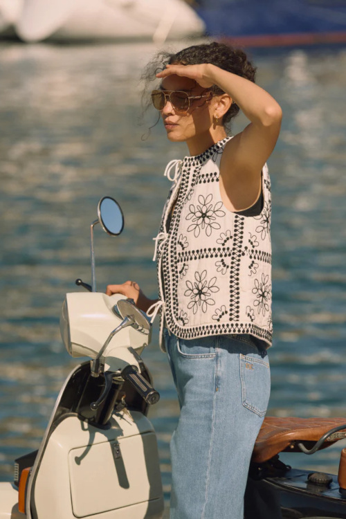 Woman wearing white tie front gilet