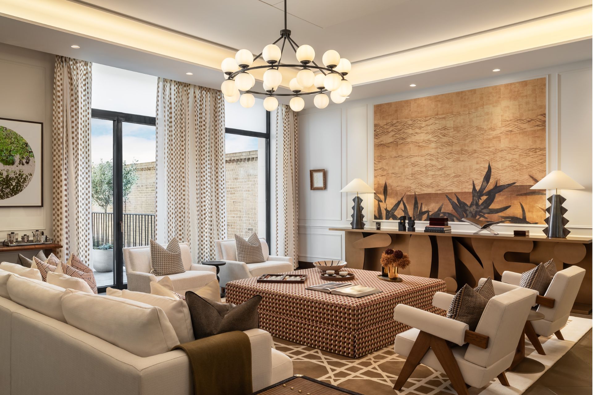 Living room with cream sofas, a patterned coffee table and a wooden console table.