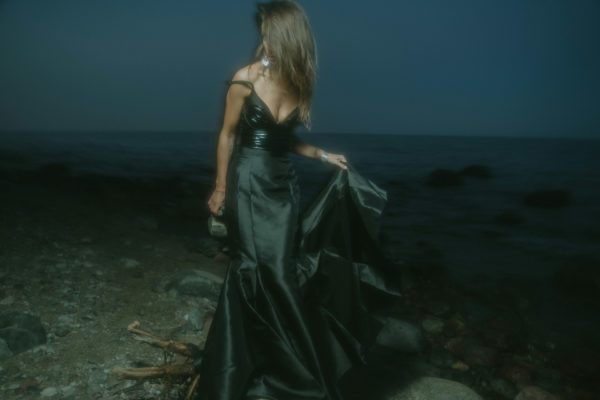 Woman in ball gown at night
