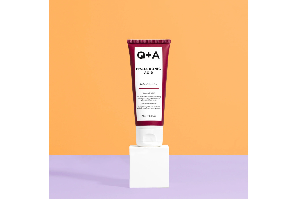 Burgundy and white bottle on orange and purple background