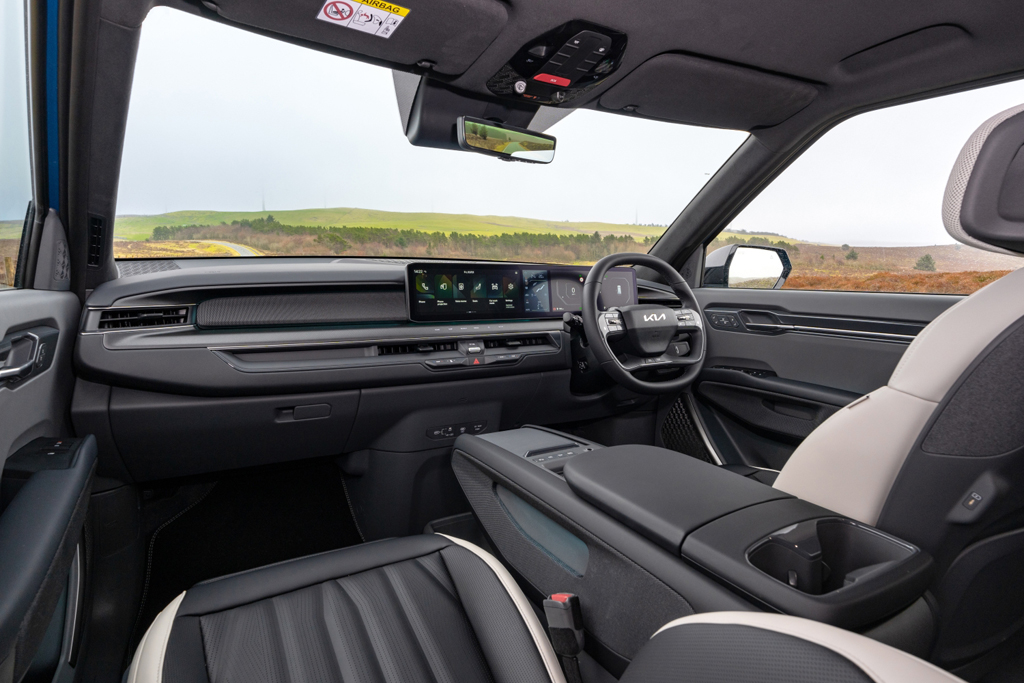 The front console and steering wheel in the Kia EV9