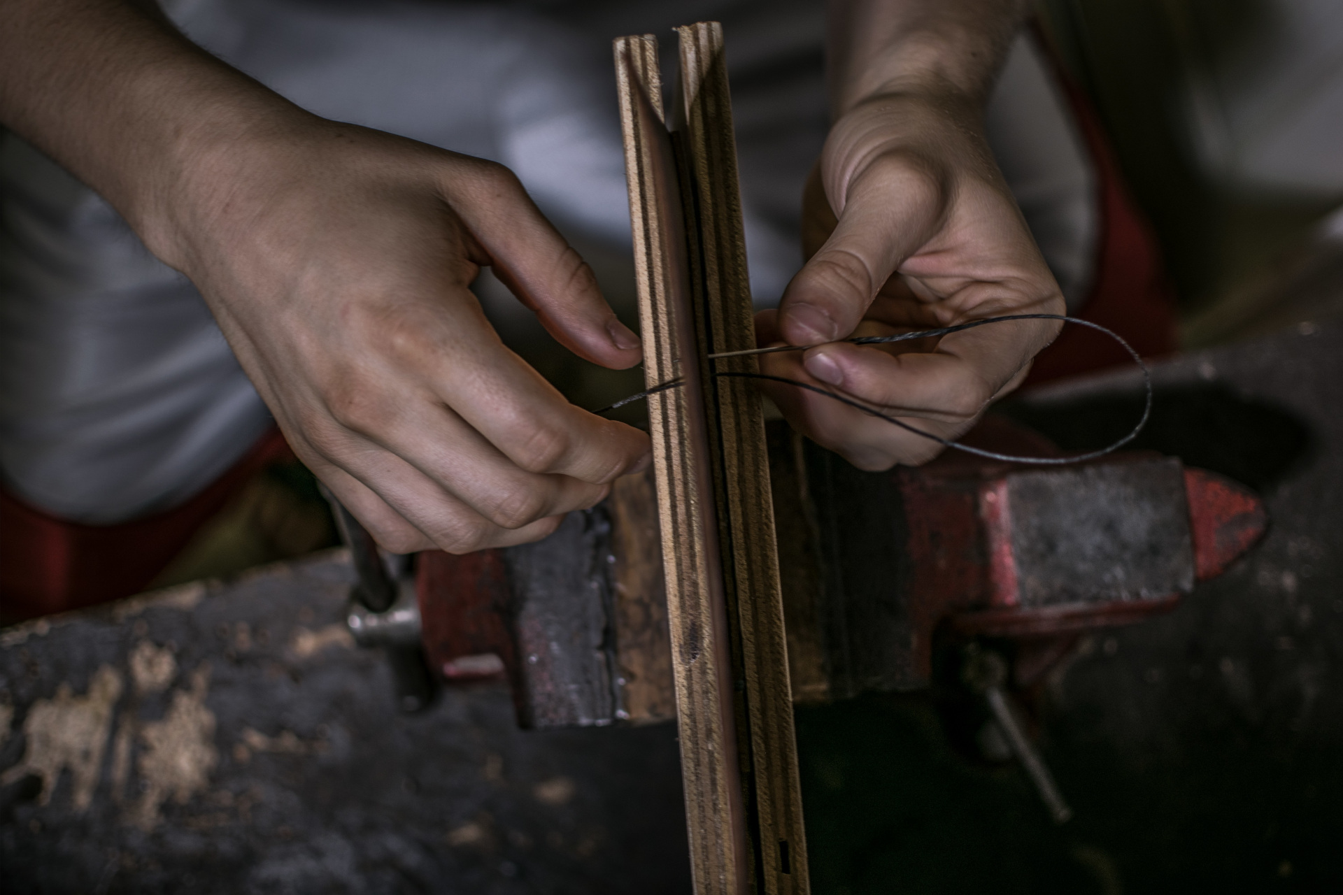 Hands making leather book