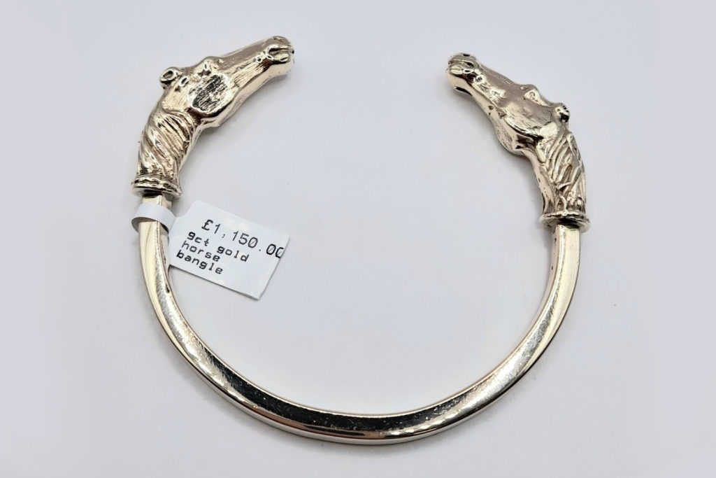 Gold bangle with horses