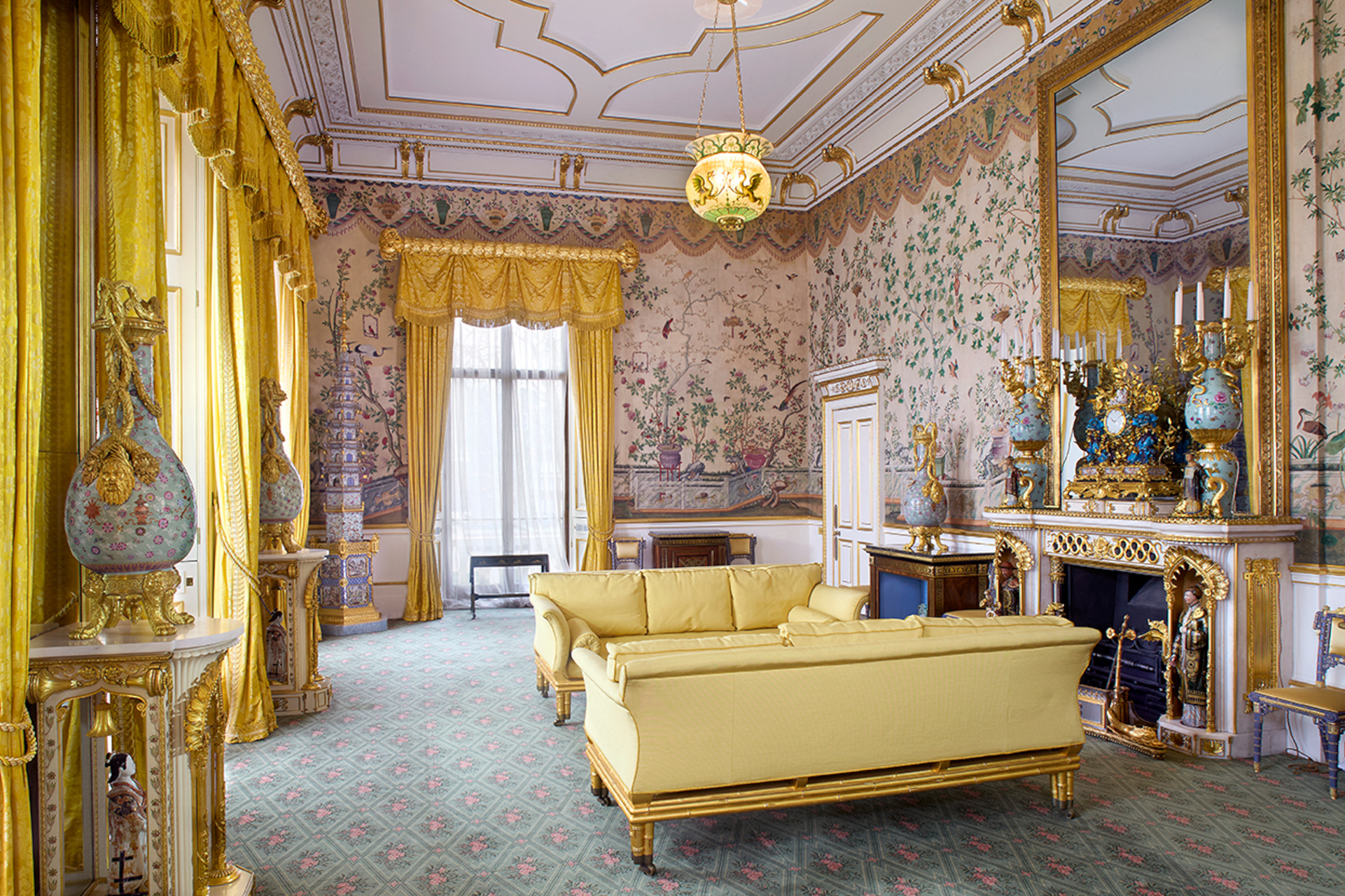 Yellow room with ornate wallpaper