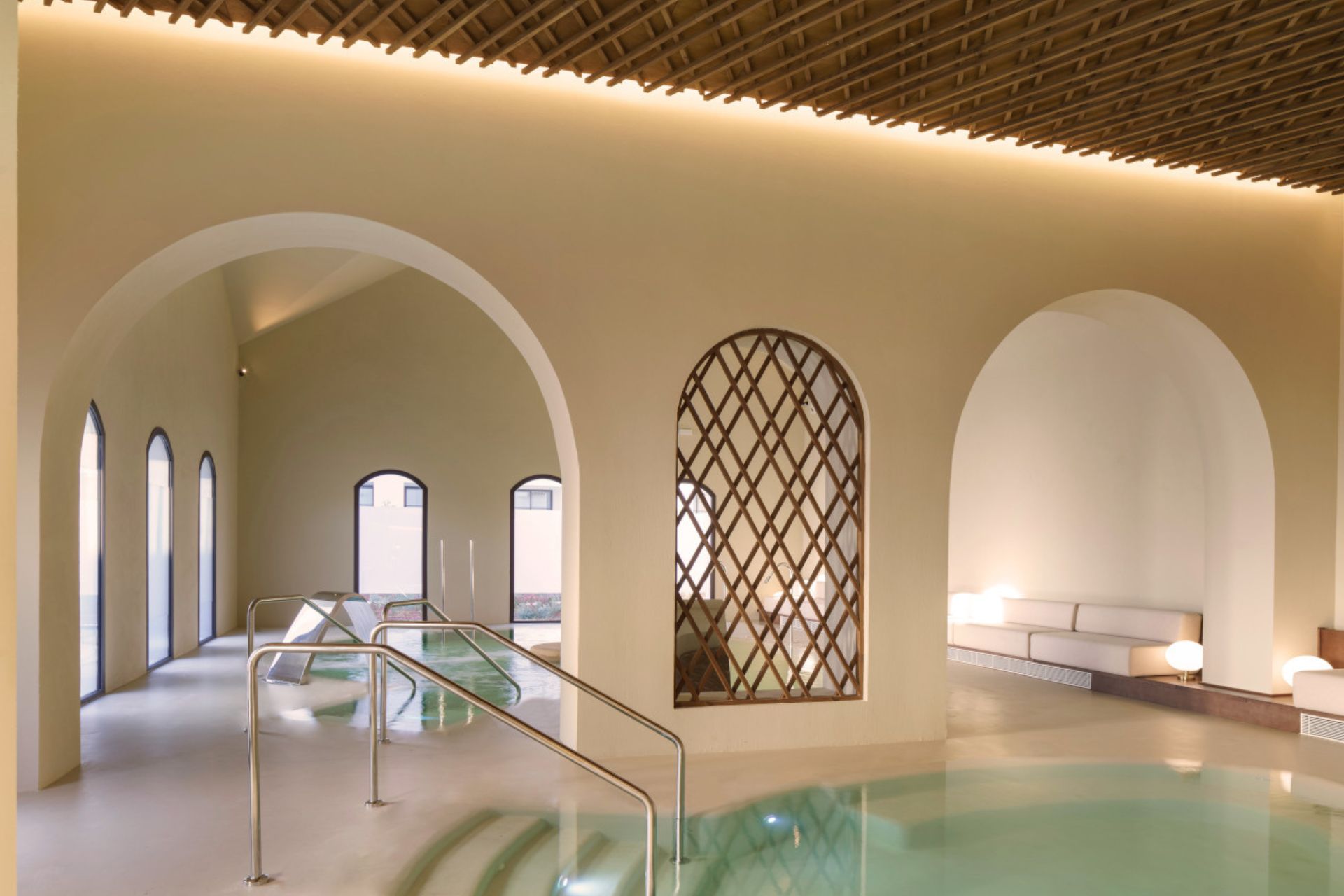 MOOD Spa at La Zambra, with a plunge pool, arched windows and wooden latticework on the ceilings.