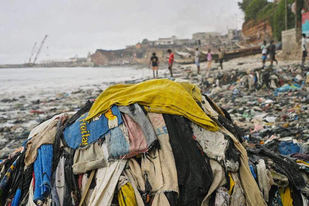 A pile of discarded clothes in landfill