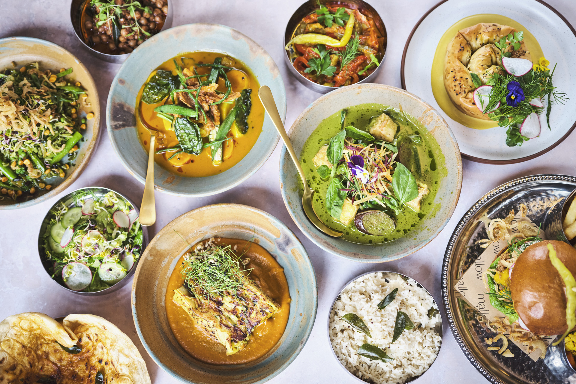 An array of dishes of food on a table