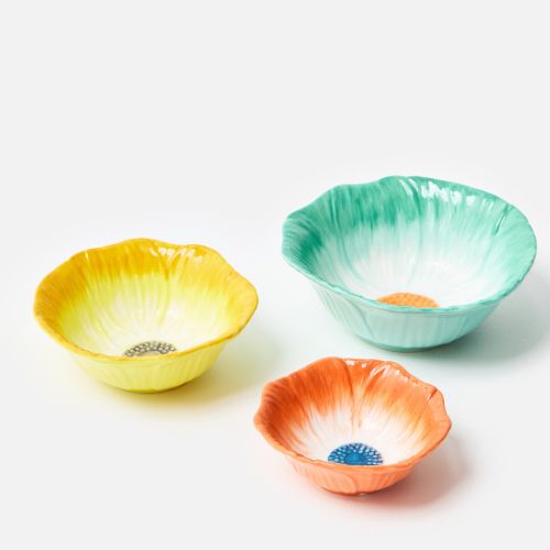 Yellow, orange blue flower-shaped nesting bowls