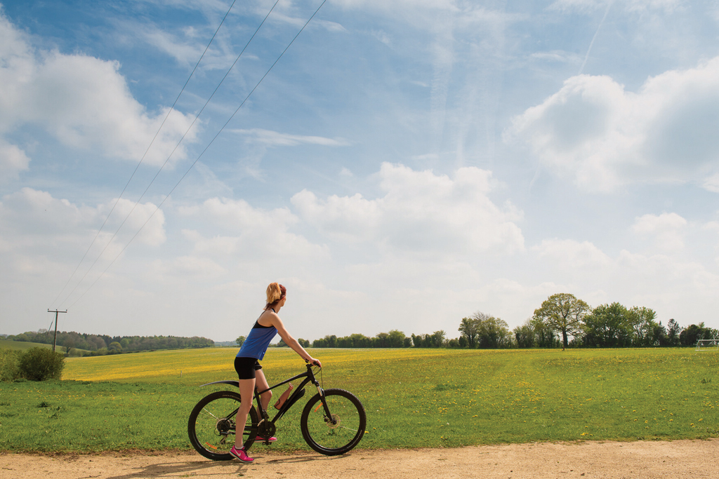A woman on staycation cycling