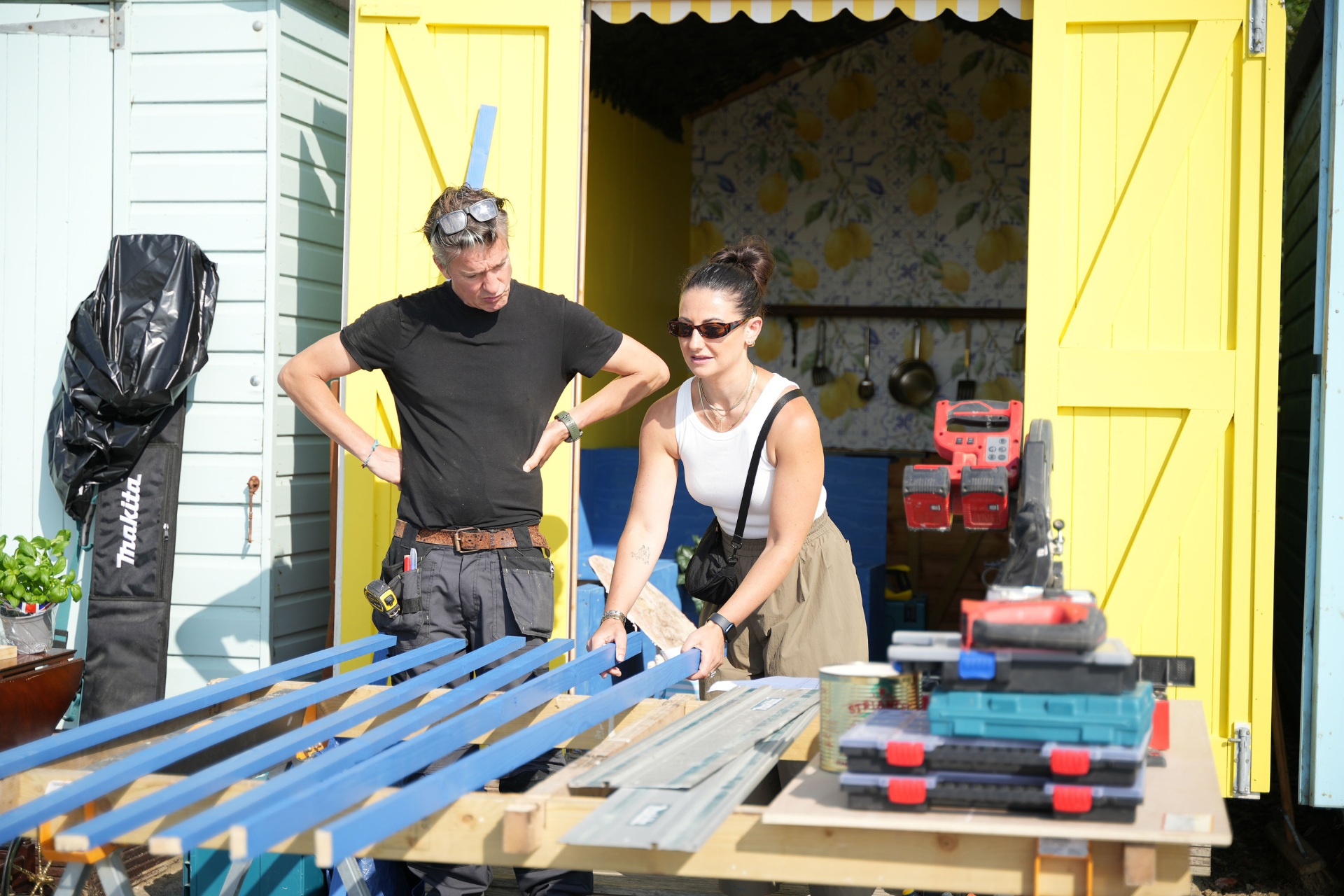 People working on beach hut