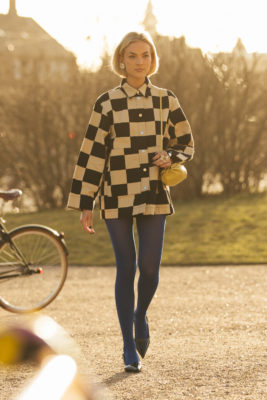 Woman in check jacket with princess bob