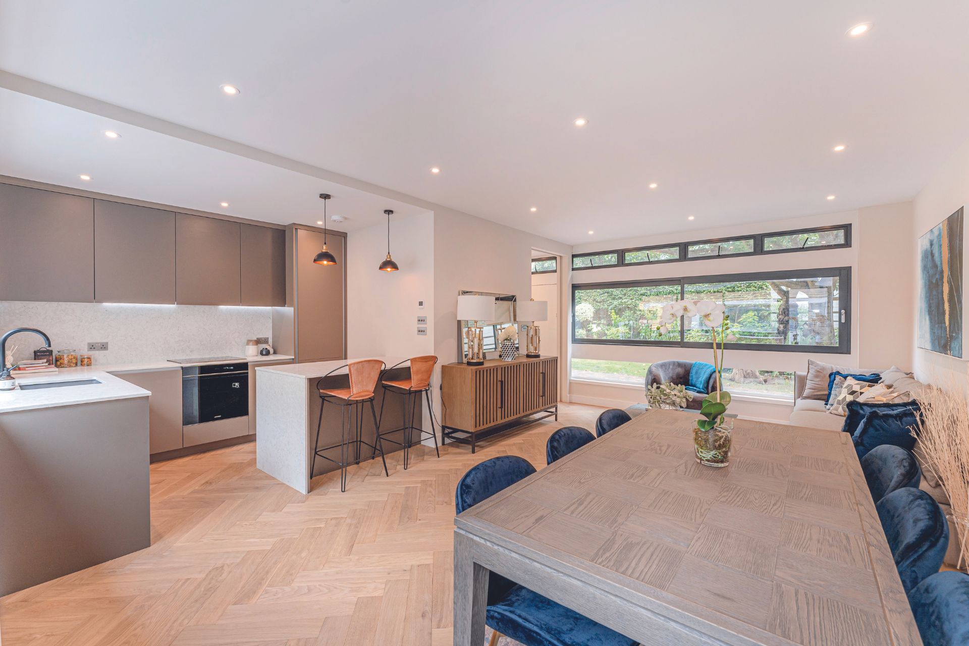 Modern kitchen with island and dining table