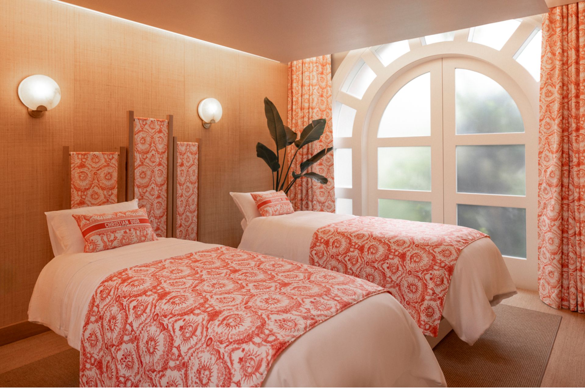Dior spa at The Beverly Hills Hotel, featuring treatment beds in a coral pink Dior print.