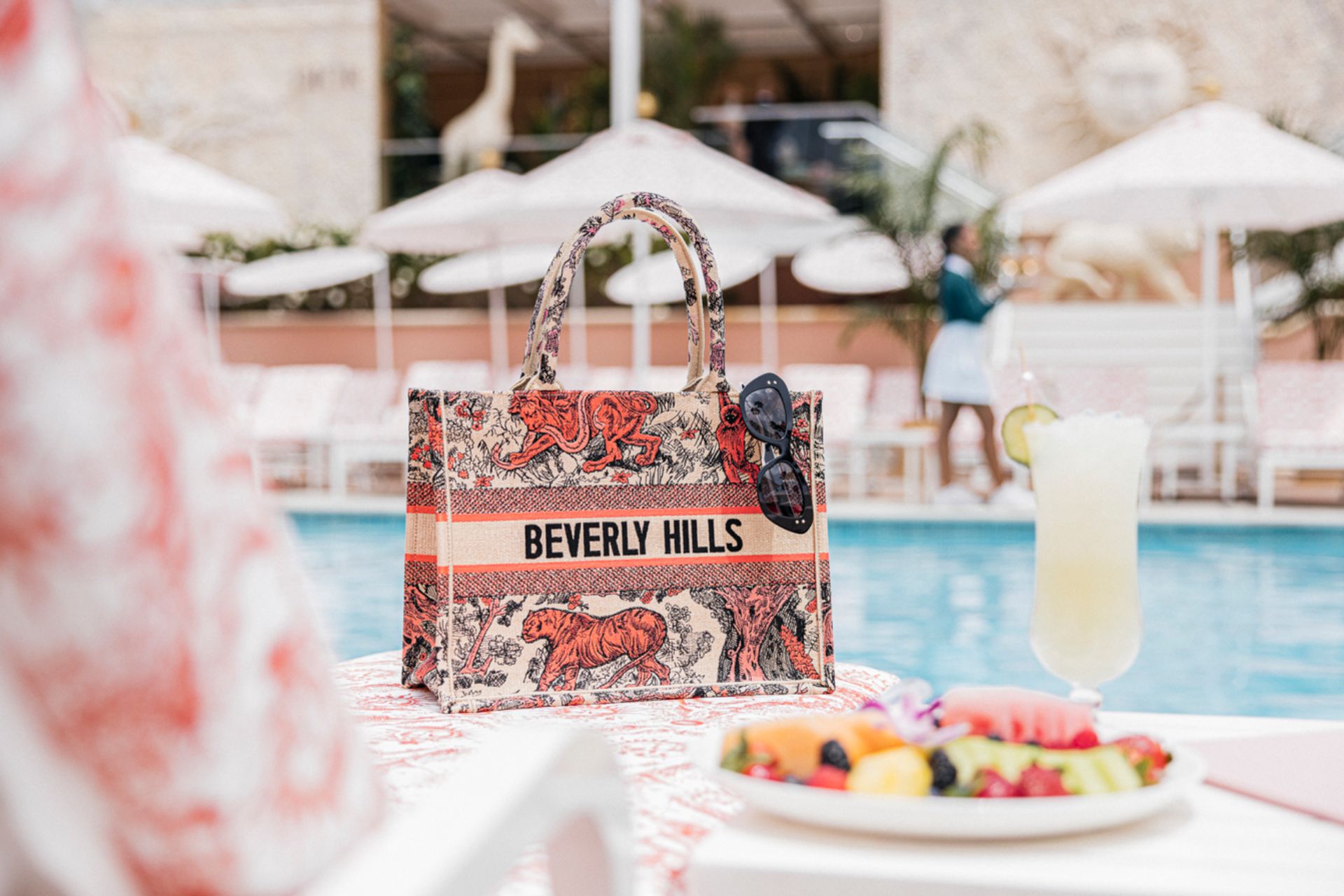 Dior tote bag on a pool lounger at The Beverly Hills Hotel