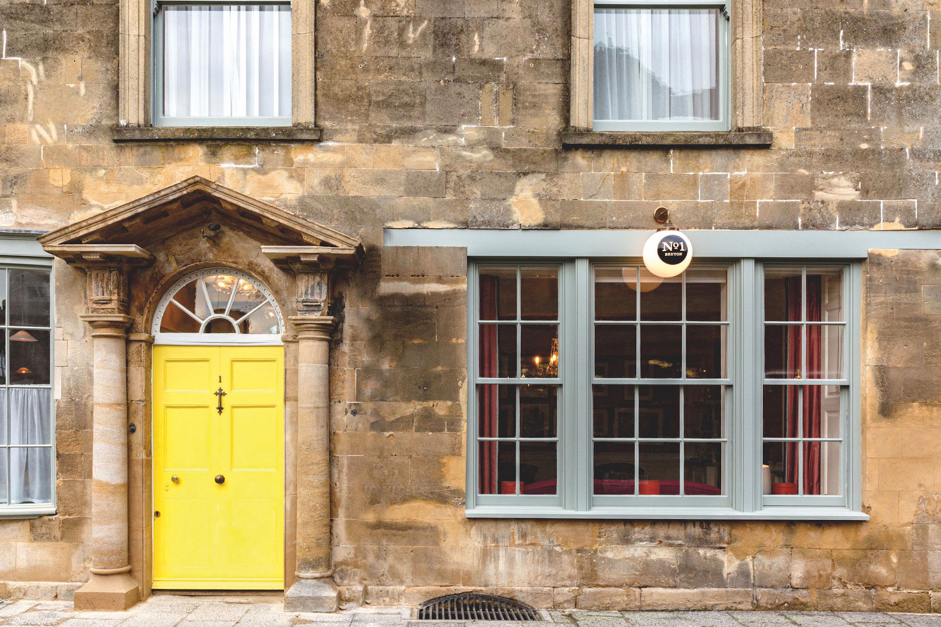 Exterior of Number One Bruton with yellow door