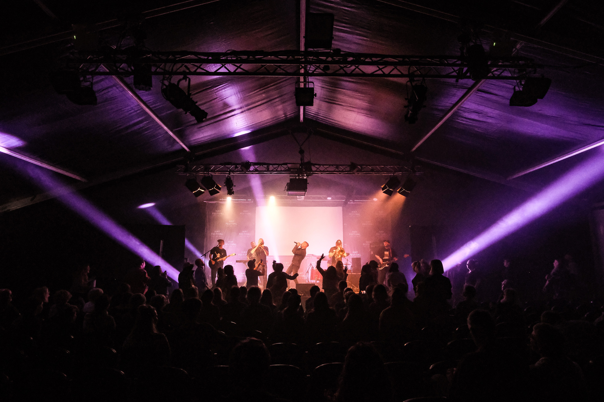 Musicians performing on stage at Hay