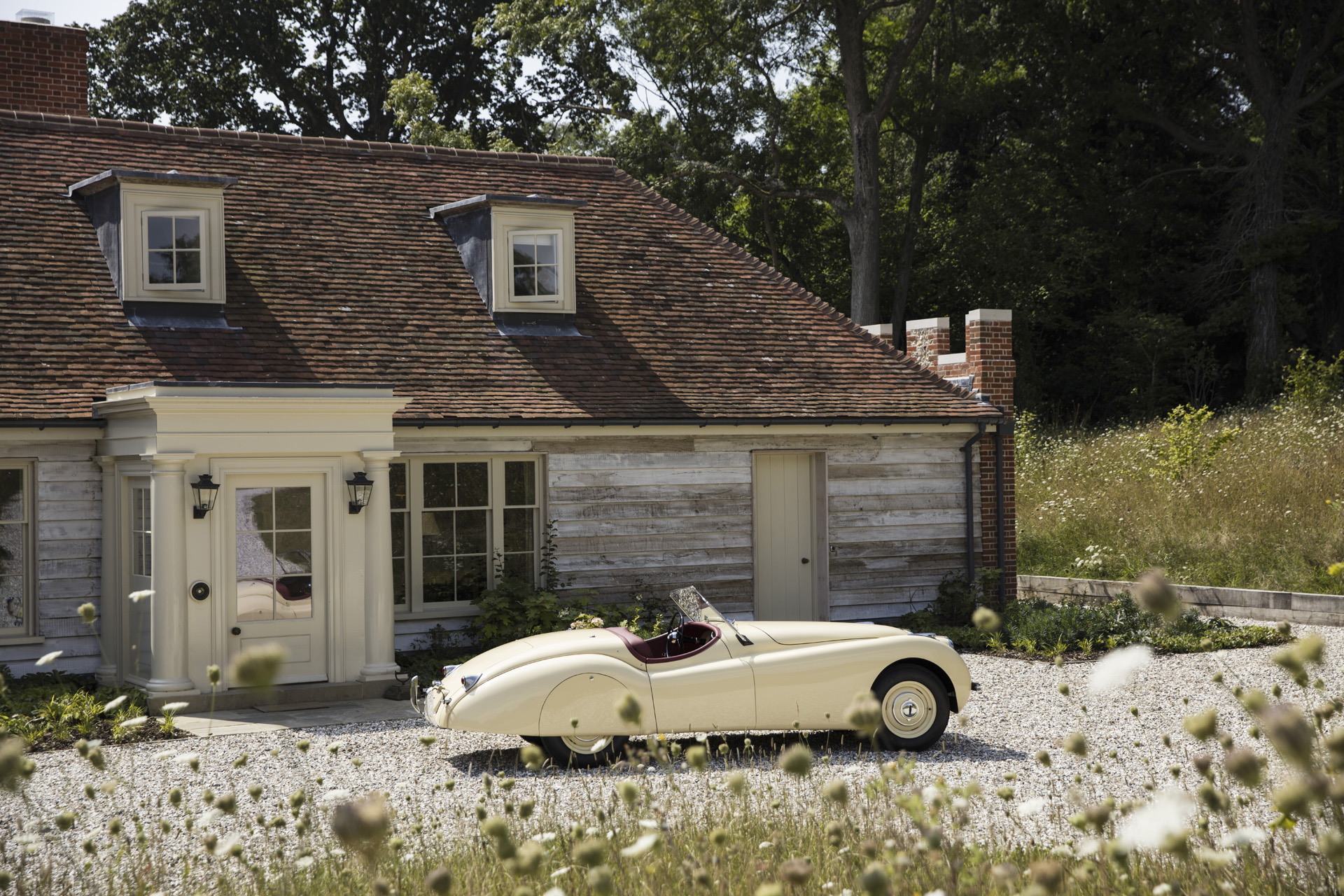 A cream car outside Hound Lodge