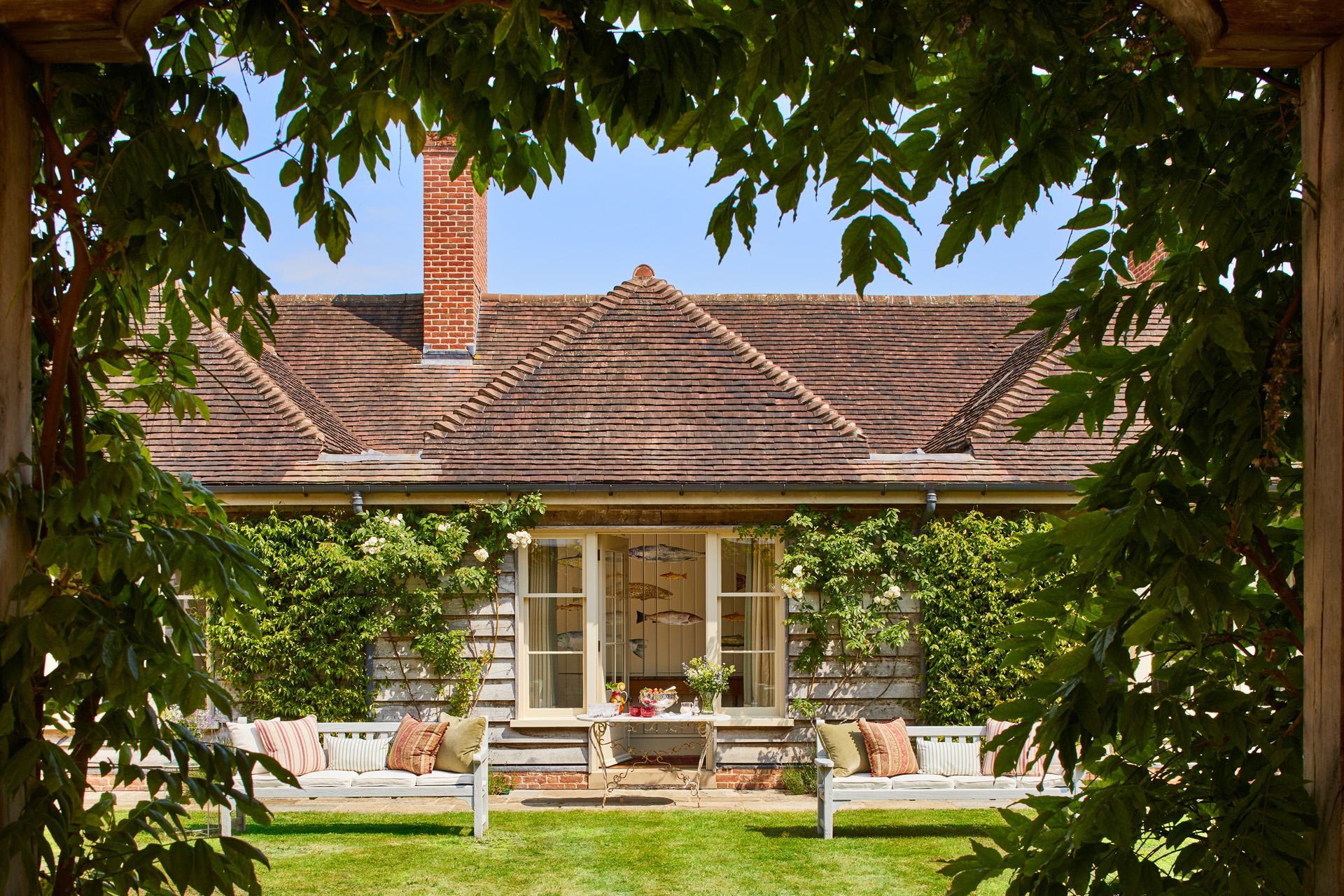 The exterior of Hound Lodge through the trees