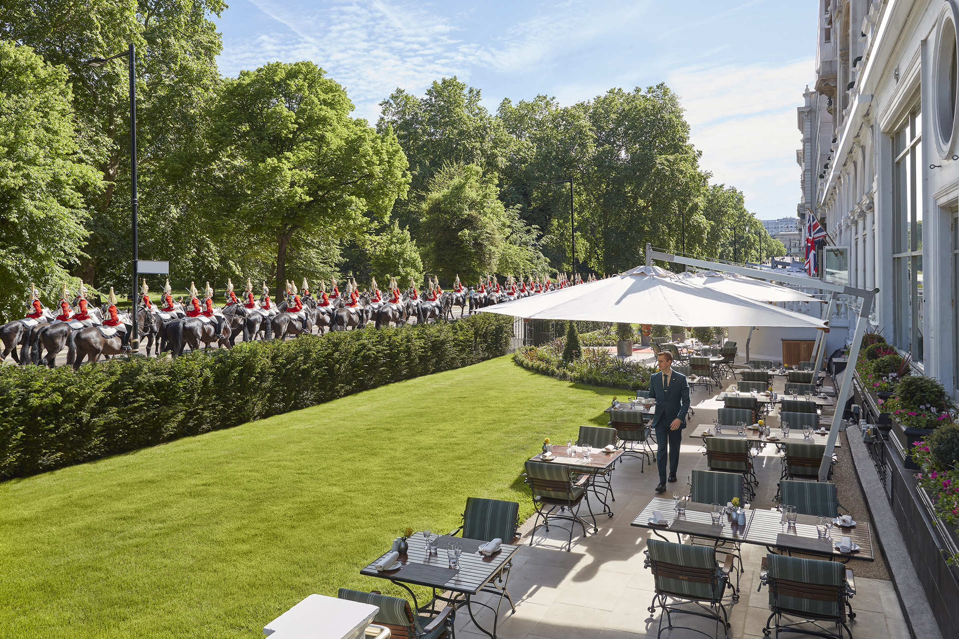 Tables outside in the sun with parasols