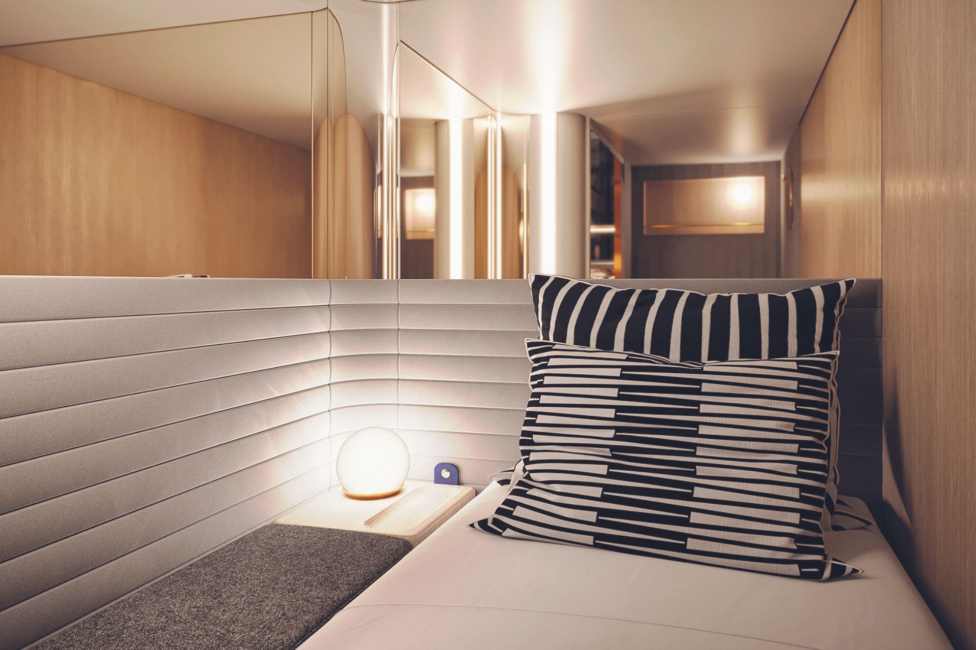 Luxury train cabin with wood panels and a bed