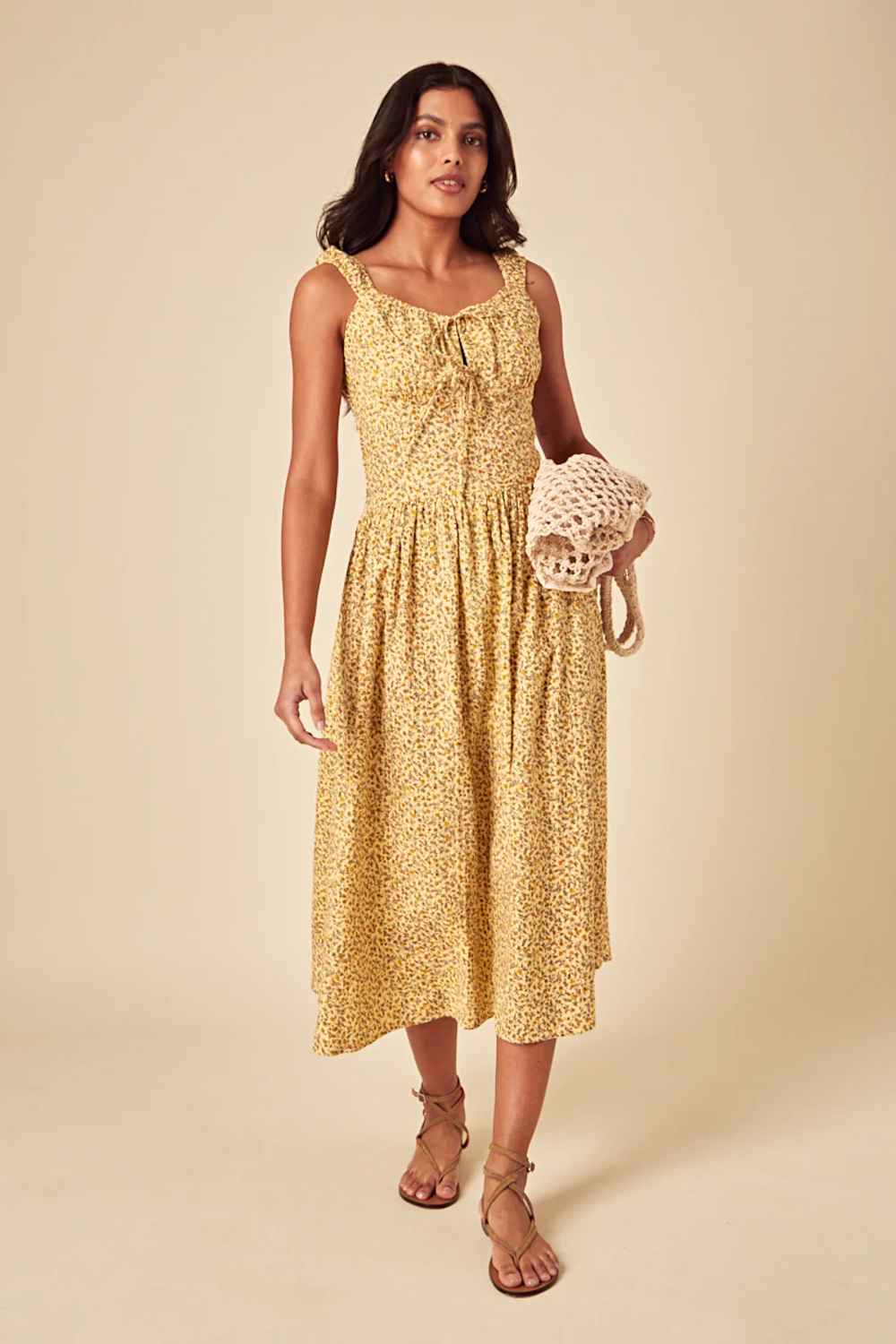 Woman in yellow milkmaid dress