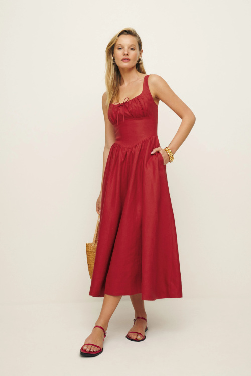 Woman in red milkmaid dress