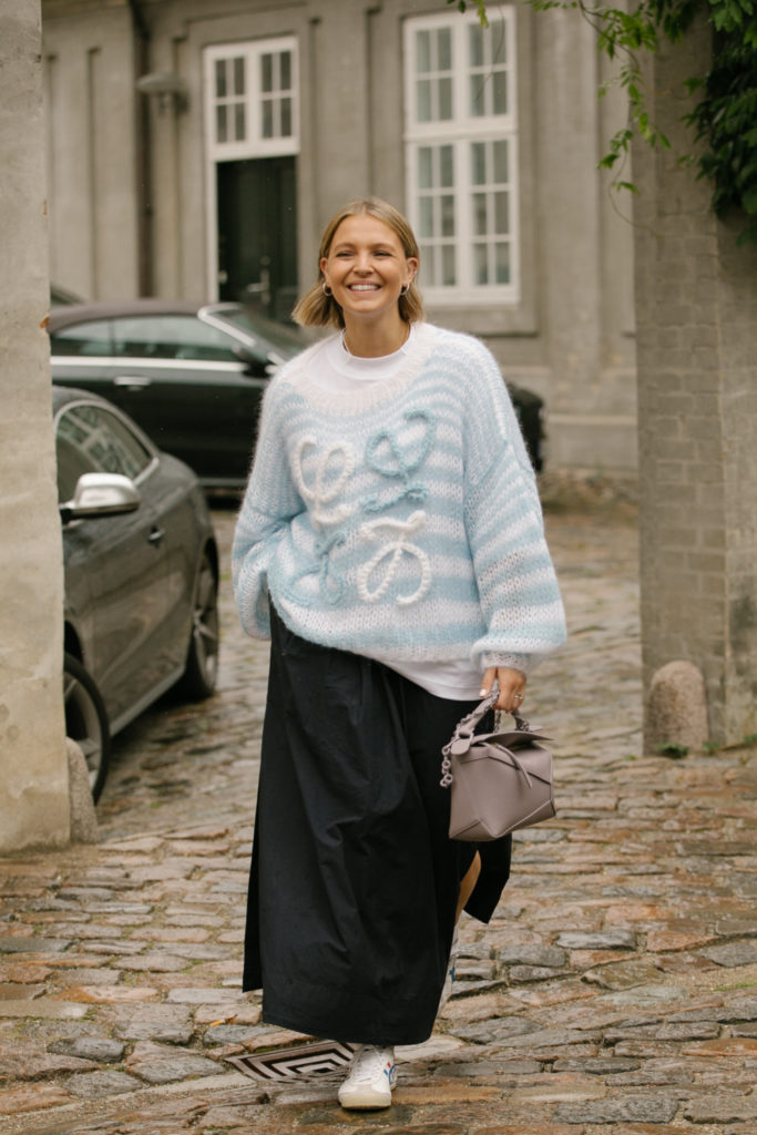 Woman with 90s bob and blue jumper