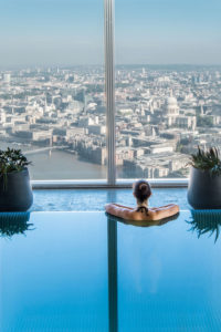 A swimming pool overlooking views of London