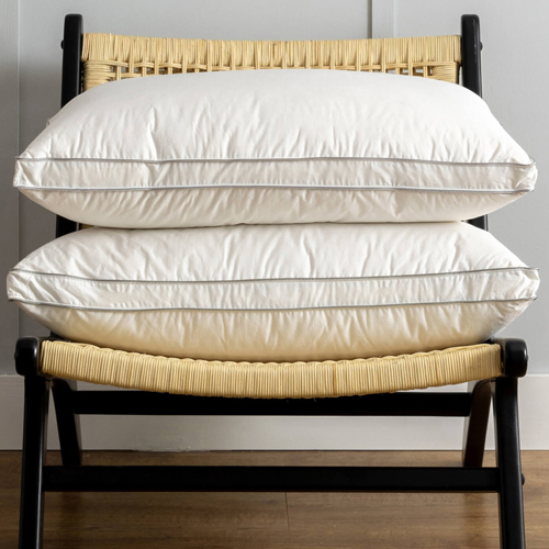 Two pillows stacked on a chair