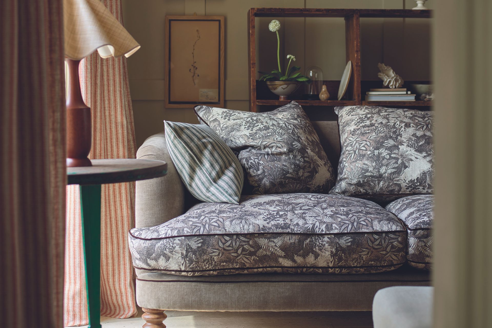 Sofa with a blue and white botanical pattern