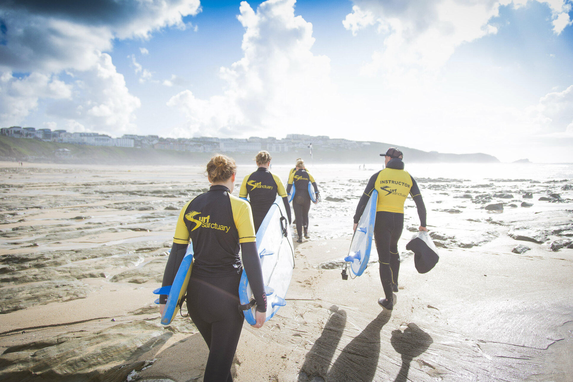 People going out for a surfing lesson