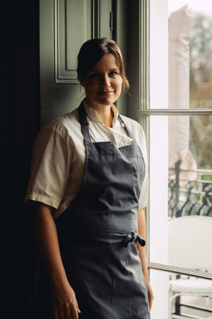 Vanessa Marx wearing a grey apron at the Riverhouse Restaurant.