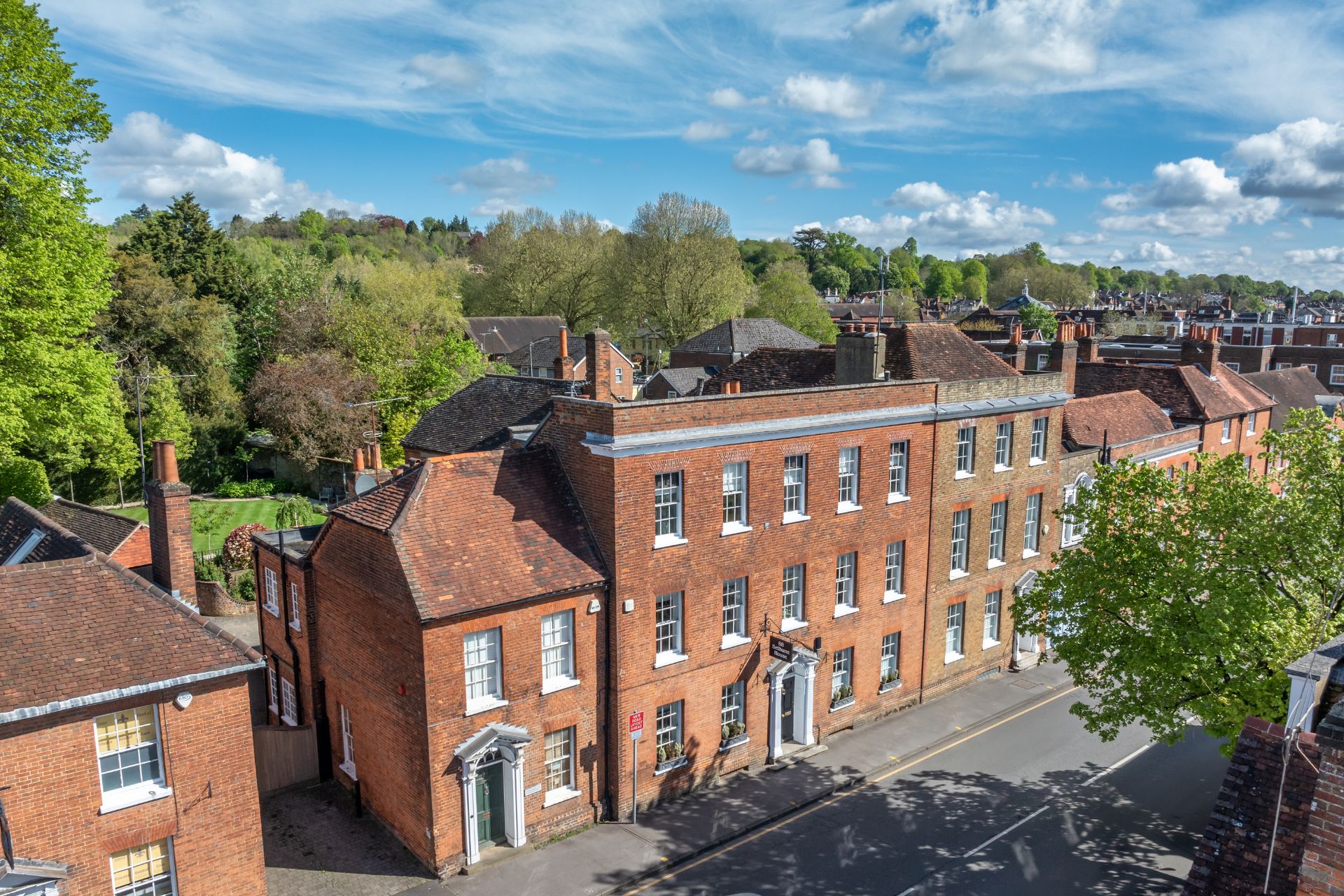 Aerial view of Grade II* listed red brick home
