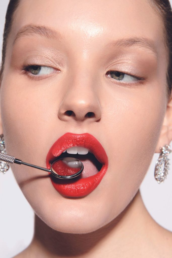 Model wearing red lipstick