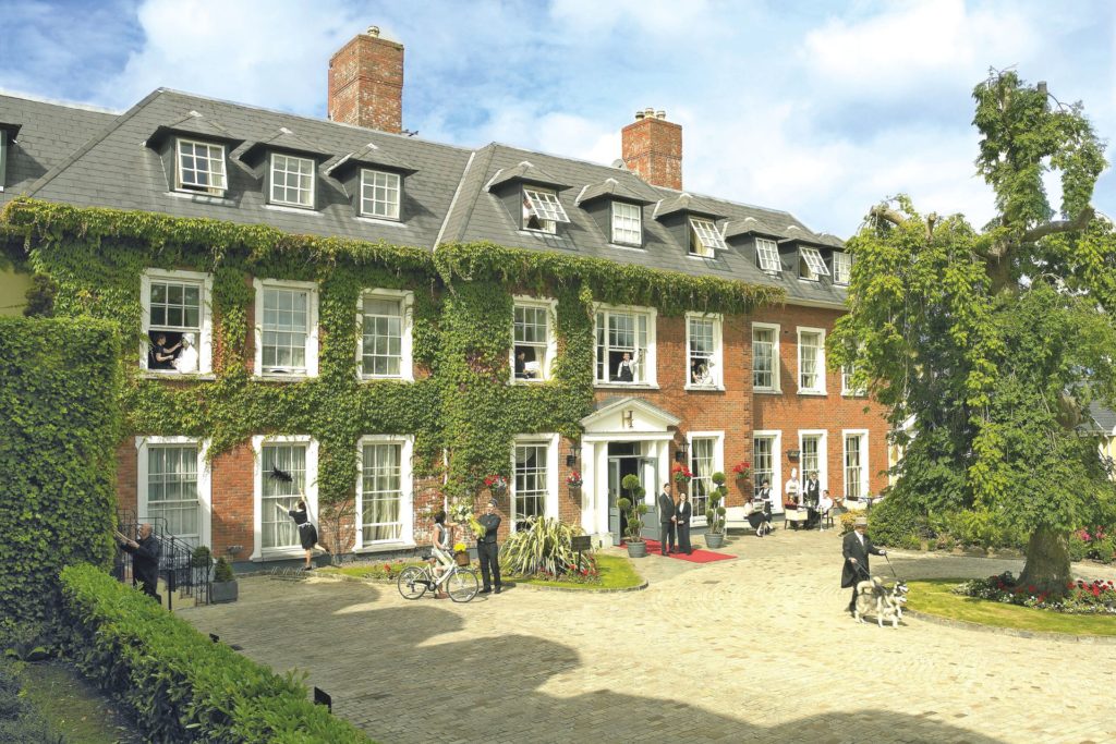 Ivy clad red brick hotel