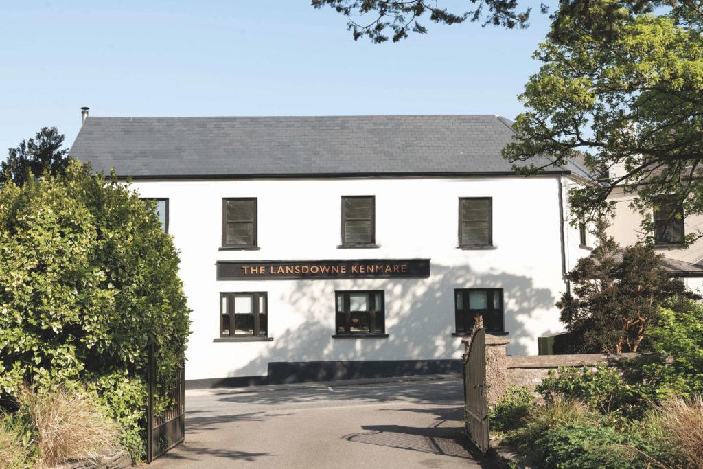 White cottage with a grey slate roof