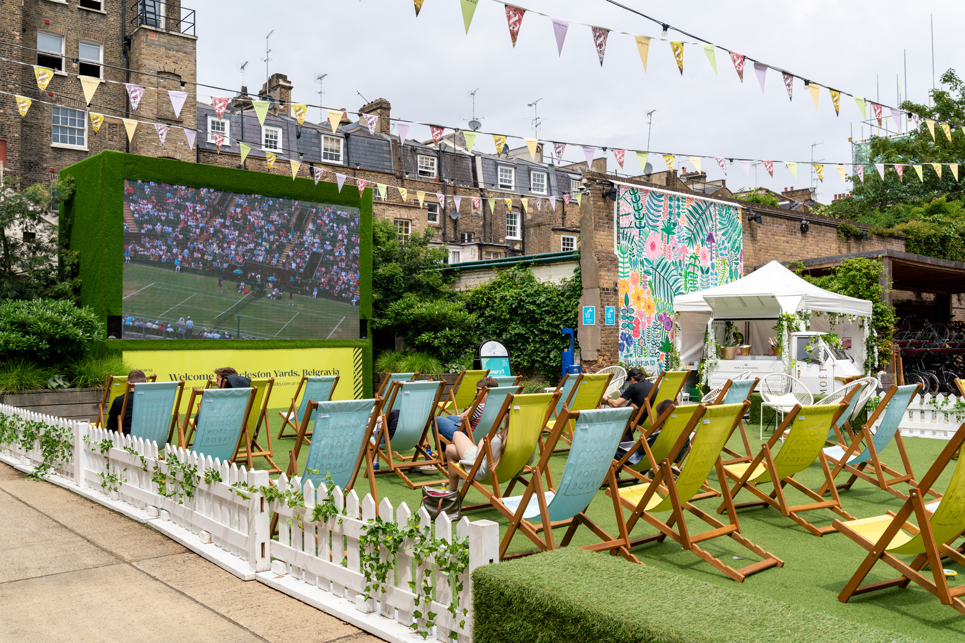 A square in London with bunting and grass ready to watch Wimbledon