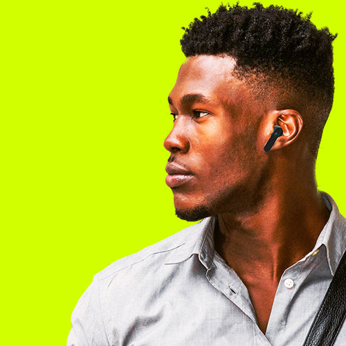 A man wearing recycled headphones