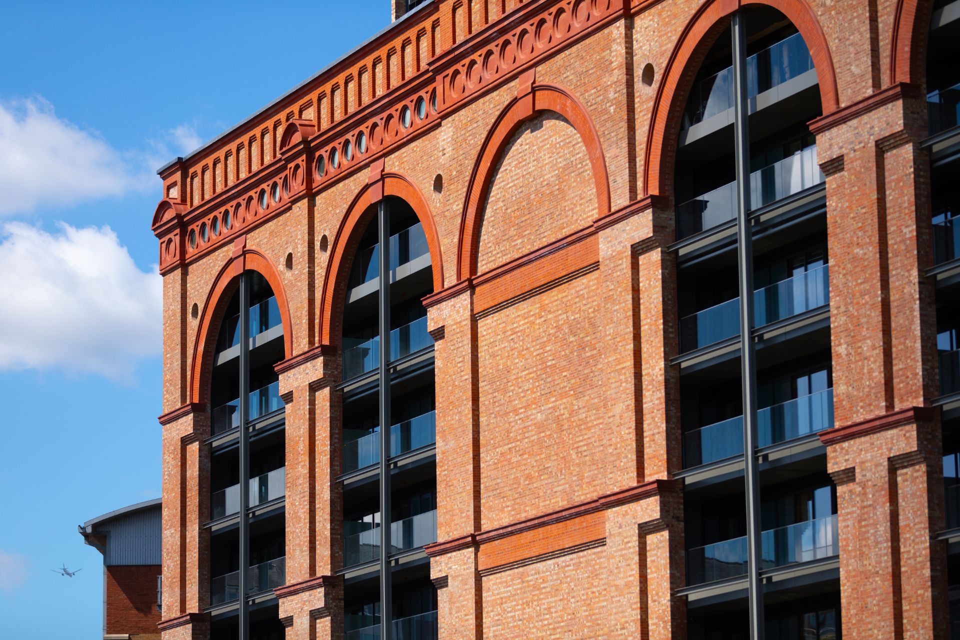 Red brick exterior of Chelsea Powerhouse, with arched windows