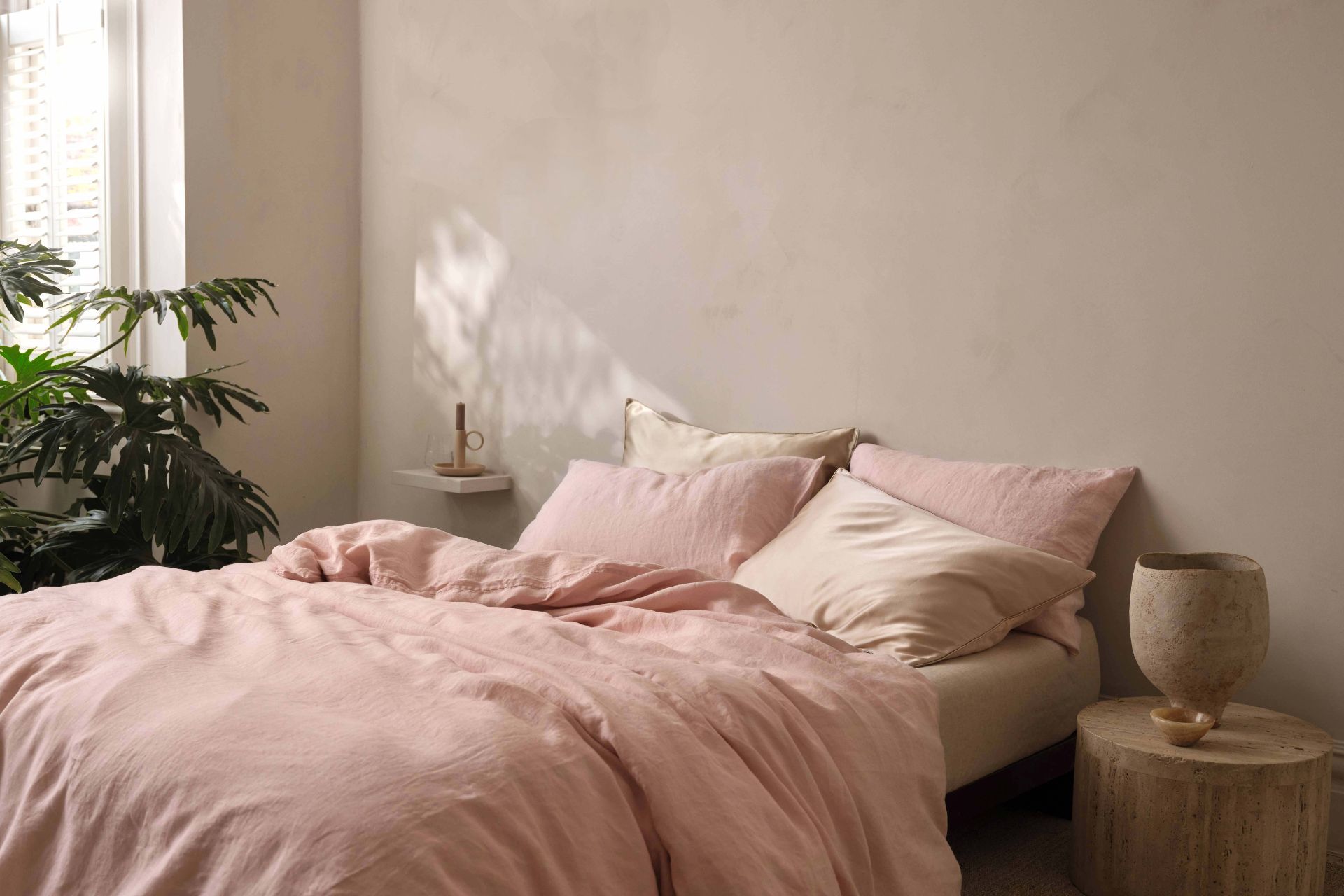 Taupe bedroom with pale pink linen bedding