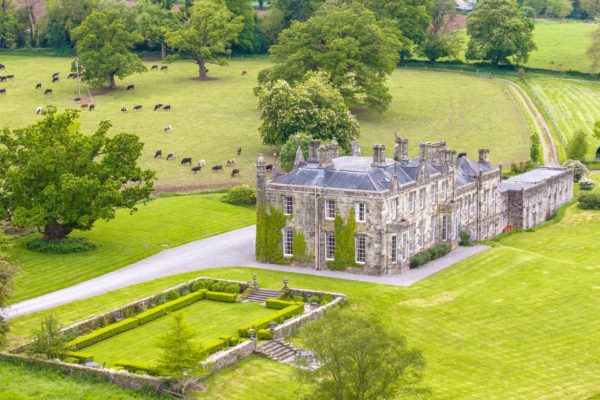 Aerial view of the Fortwilliam Estate, a stone country manor surrounded by parkland